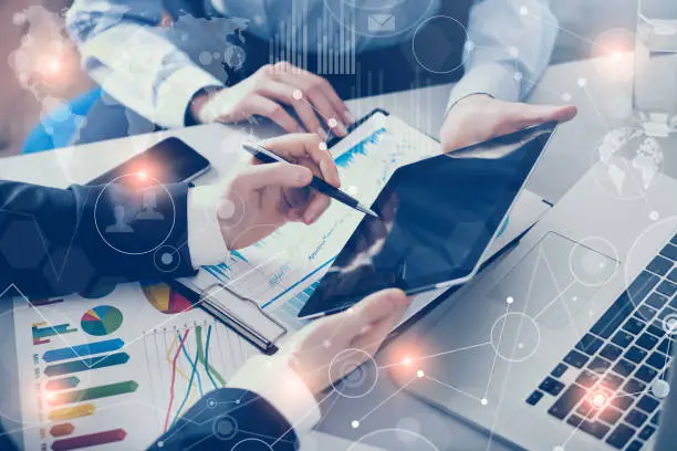 Business consulting services in Dubai – team reviewing financial charts